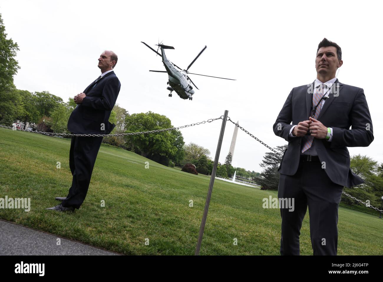 Members Od The U.S. Service Stand Guard As Marine One Carrying U.S ...