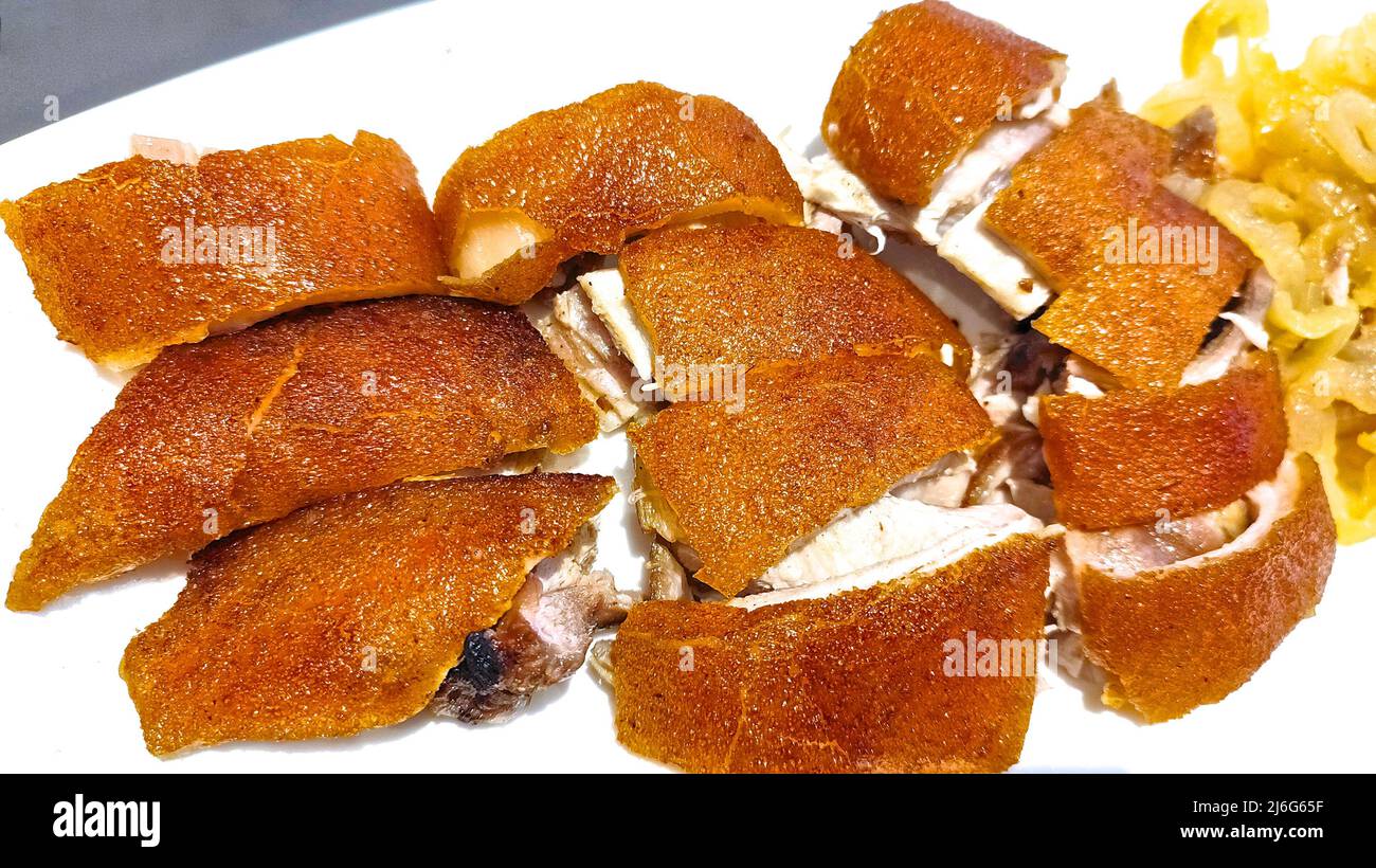 BBQ Suckling pig on white colour dish Stock Photo