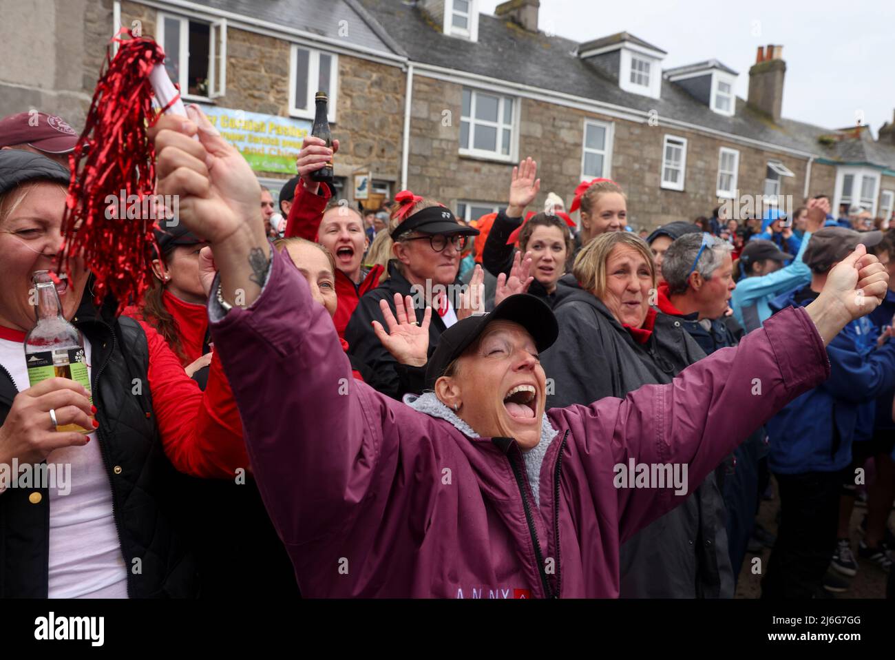Spectators watch the awards ceremony at the World Pilot Gig rowing Championships in Hugh Town, St Mary's, in the Isles of Scilly, Britain, May 1, 2022. REUTERS/Tom Nicholson Stock Photo