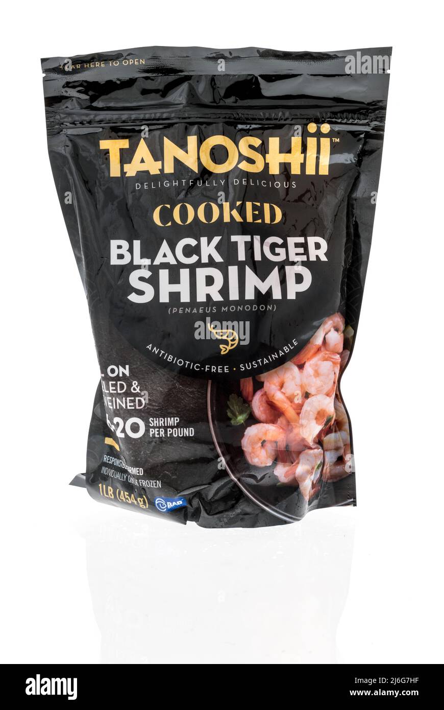 Winneconne, WI -23 April 2022: A package of Tanoshii cooked black tiger shrimp on an isolated background Stock Photo