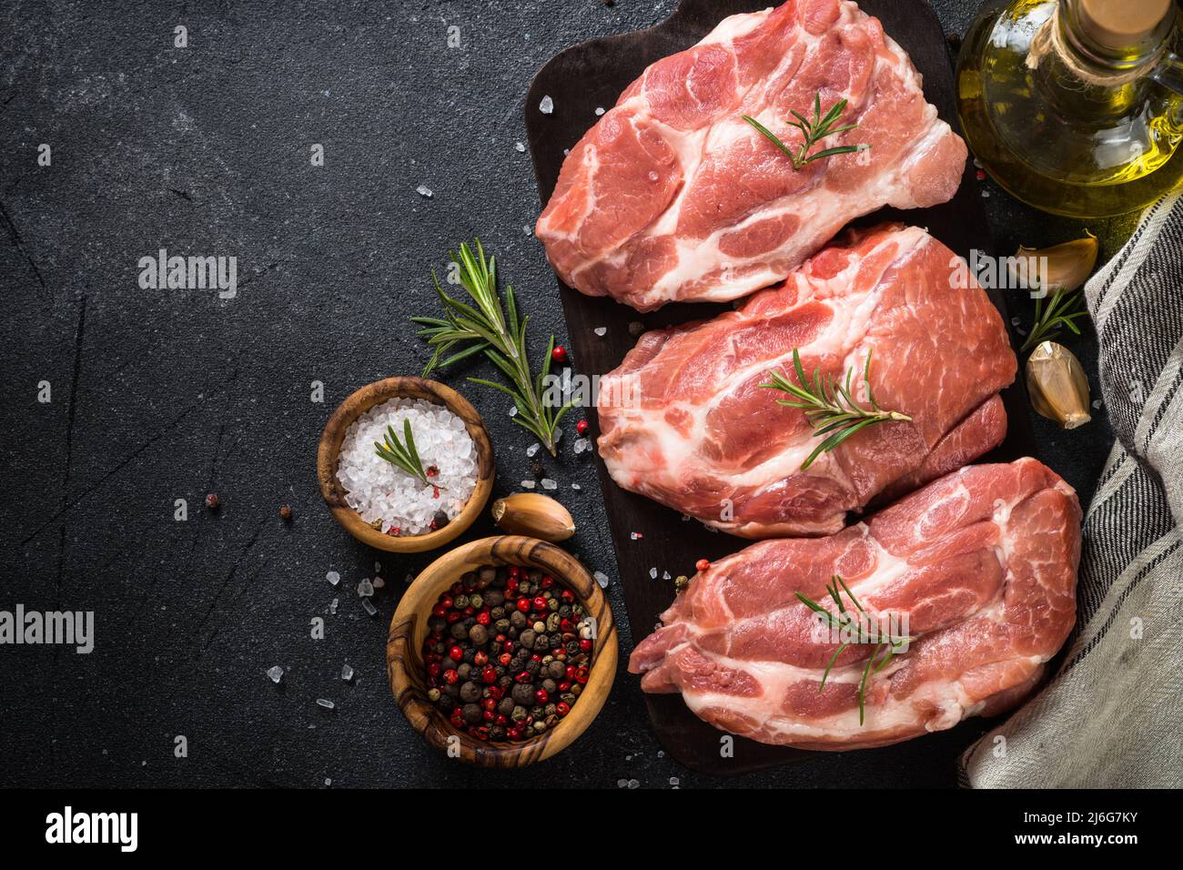 Fresh steaks with herbs and spices at black background Stock Photo Alamy