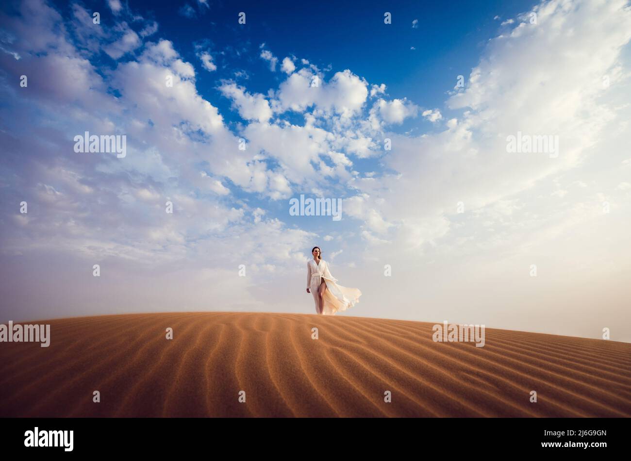 Woman finding freedom in desert Stock Photo