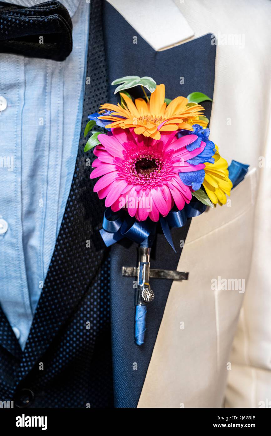 I photographed a bouquet boutonnière used by the bride and groom at a wedding reception. Stock Photo