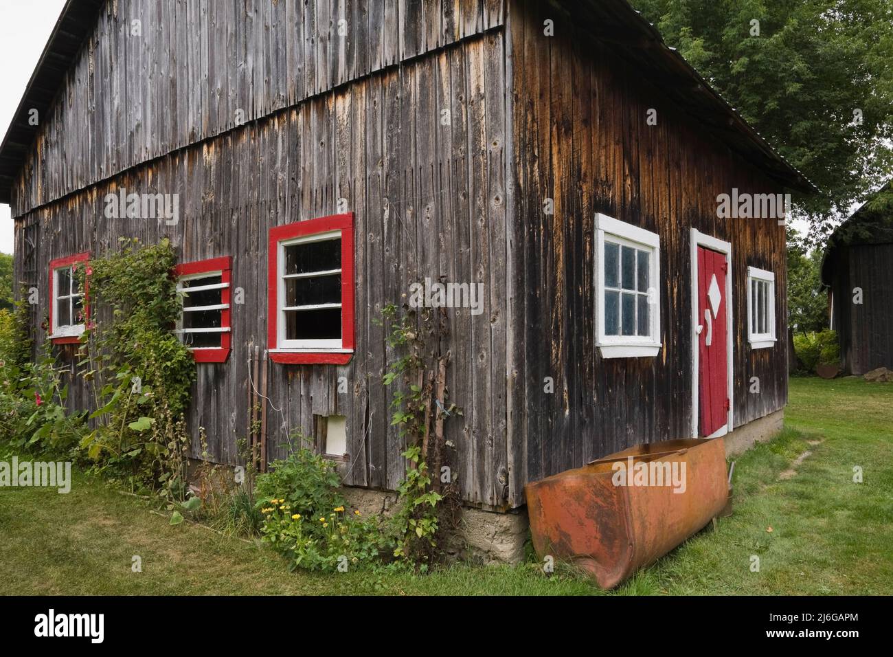 Old wooden barn with red and white trim Stock Photo - Alamy