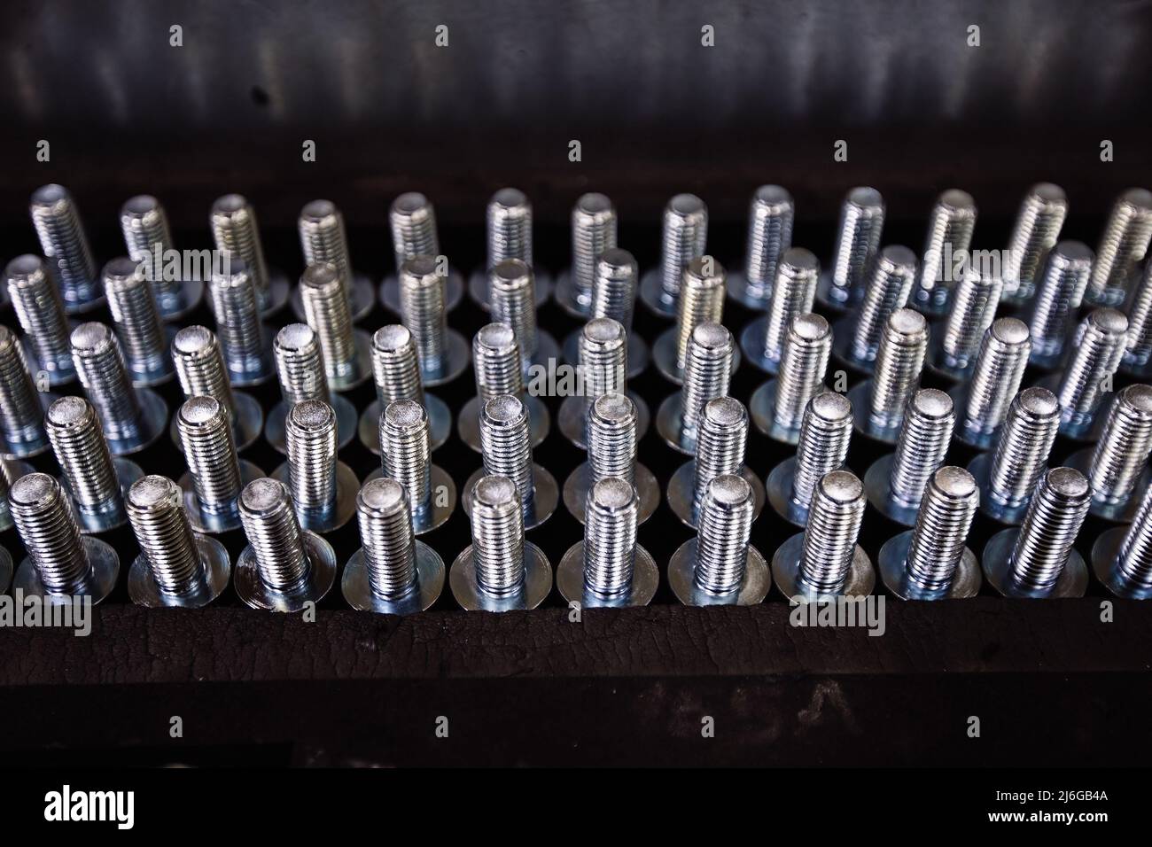 Bolts in the rack, close up view Stock Photo - Alamy