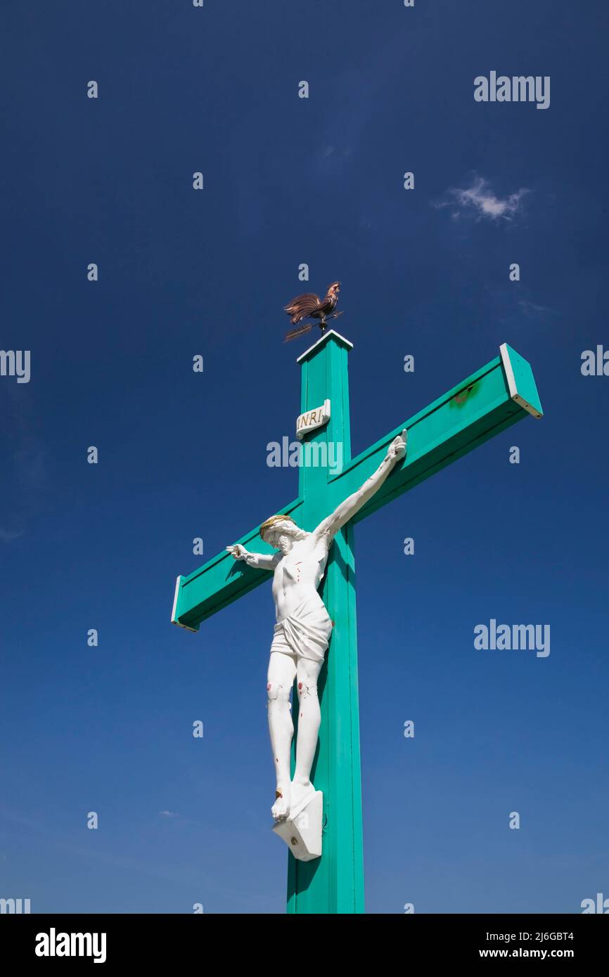 Jesus on the Cross against a blue sky background Stock Photo - Alamy