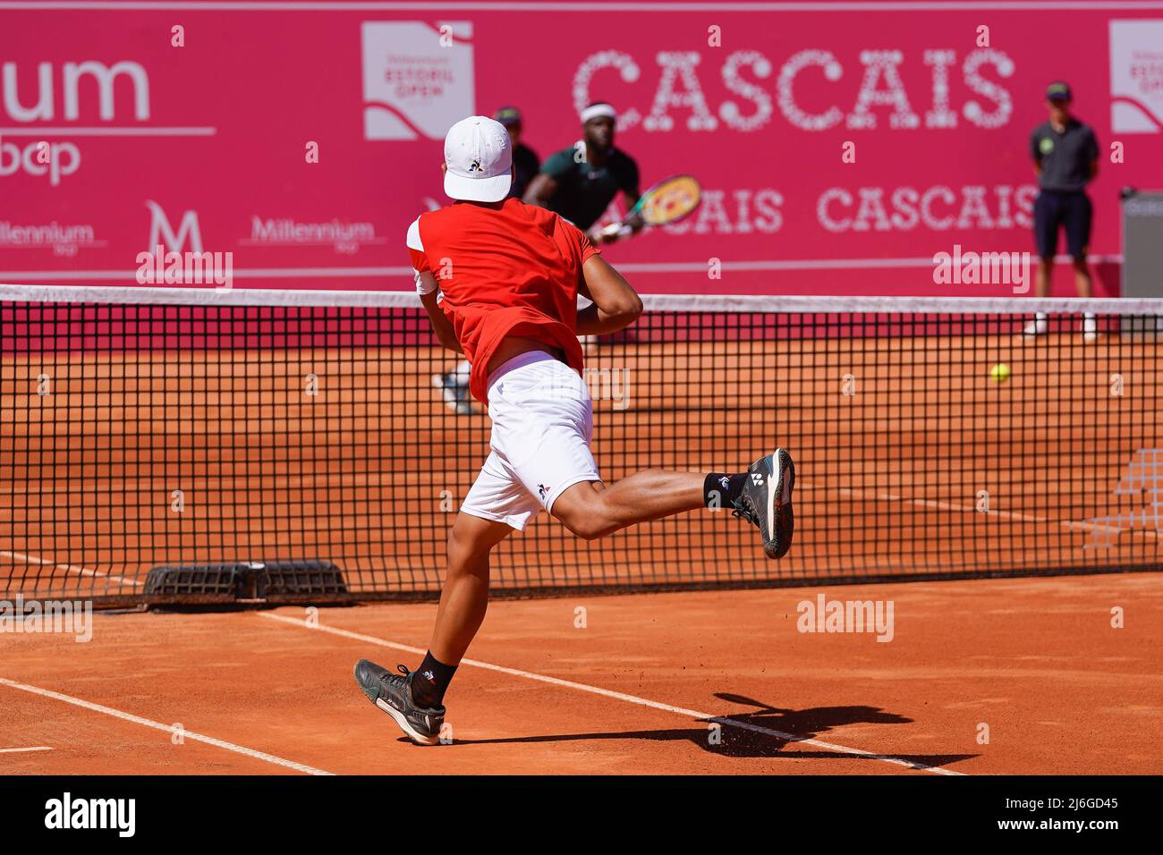 Sebastian Baez from Argentina returns a ball to Frances Tiafoe from United  States of America during the Millennium Estoril Open Final ATP 250 tennis  tournament at the Clube de Tenis do Estoril.Final