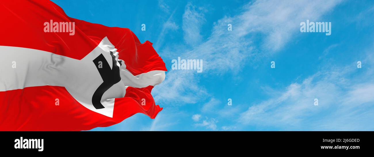 official flag of All-Germanic Heathens Front , Norway at cloudy sky background on sunset, panoramic view. Norwegian travel and patriot concept. copy s Stock Photo