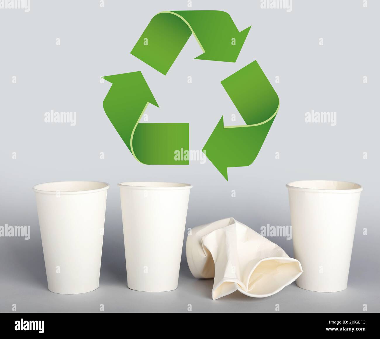 Takeaway paper cups and symbol of recycling on light background Stock ...