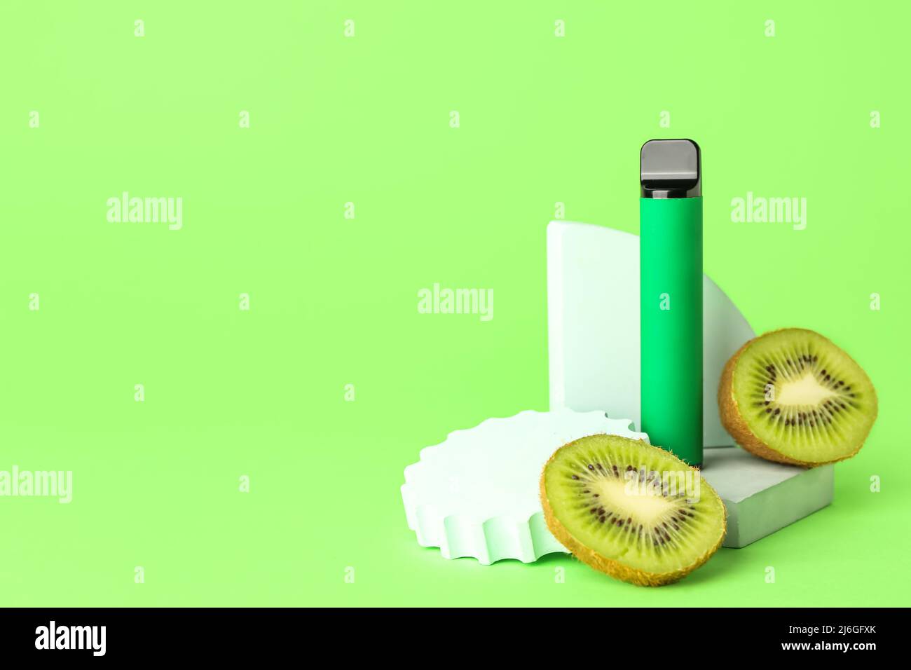 Disposable electronic cigarette and kiwi on green background Stock Photo Alamy