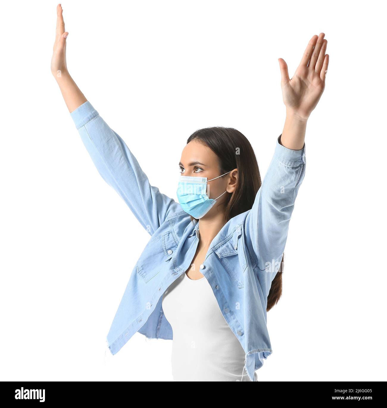 Young woman in medical mask showing stop gesture on white background ...