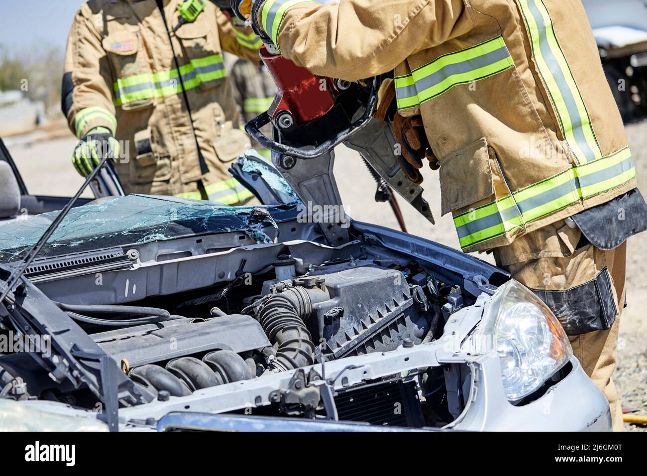 Fire Fighters using the Jaws of Life to dismantle a car during a demonstration Stock Photo