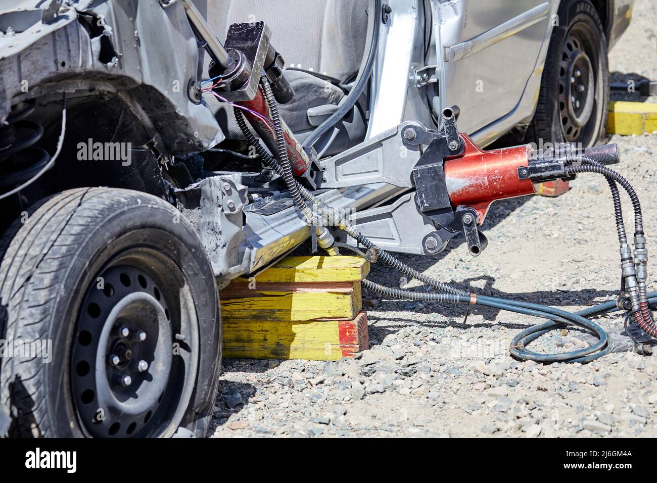 Close up of Fire Fighters using the Jaws of Life to dismantle a car during a demonstration Stock Photo