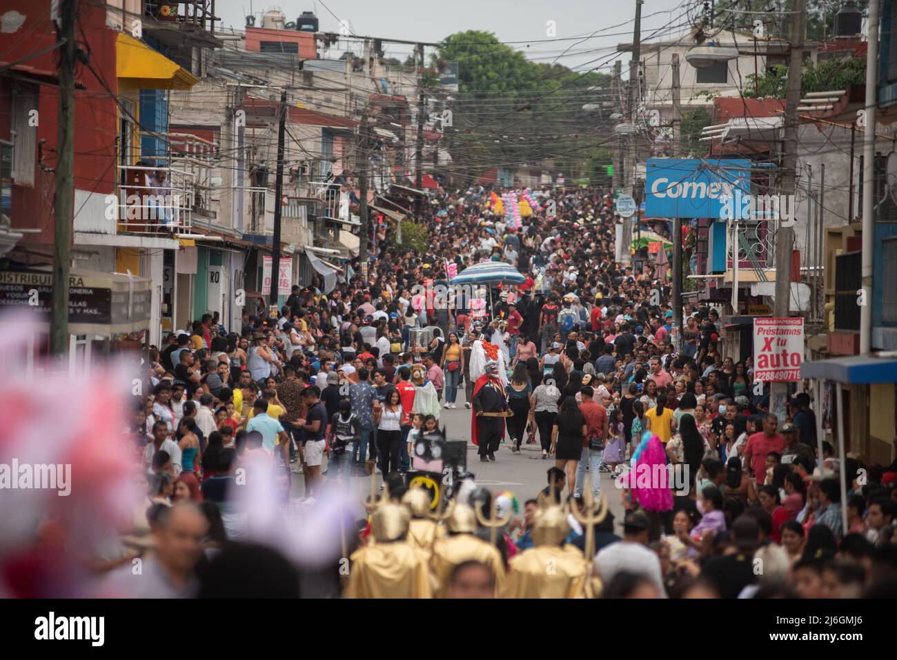 Veracruz, Mexico. May 1, 2022: Thousands of people celebrate the  traditional Carnival of the ''Boneteros'' in the town of Tuzamapan, Veracruz.  This carnival is over 100 years old and is celebrated at