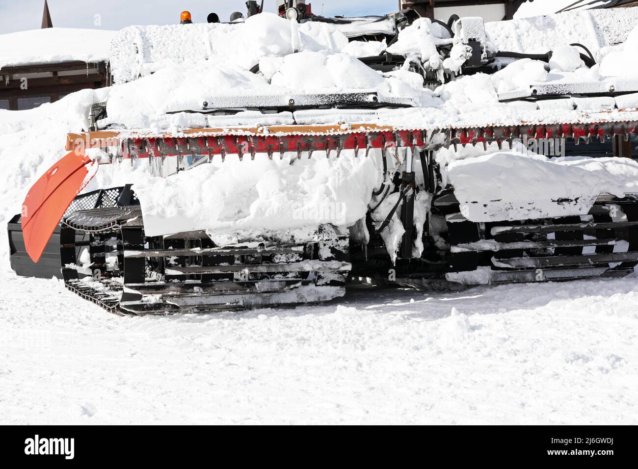 Snow grooming machine preparing ski slope at  ski resort Stock Photo