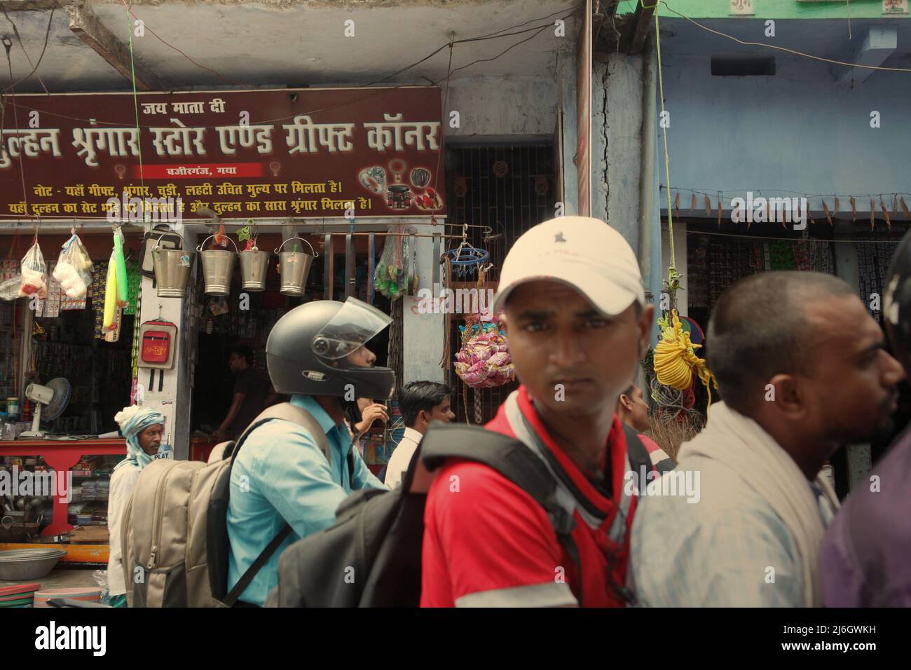 Motorists during a traffic jam in a background of a roadside shop in Bihar, India. Stock Photo