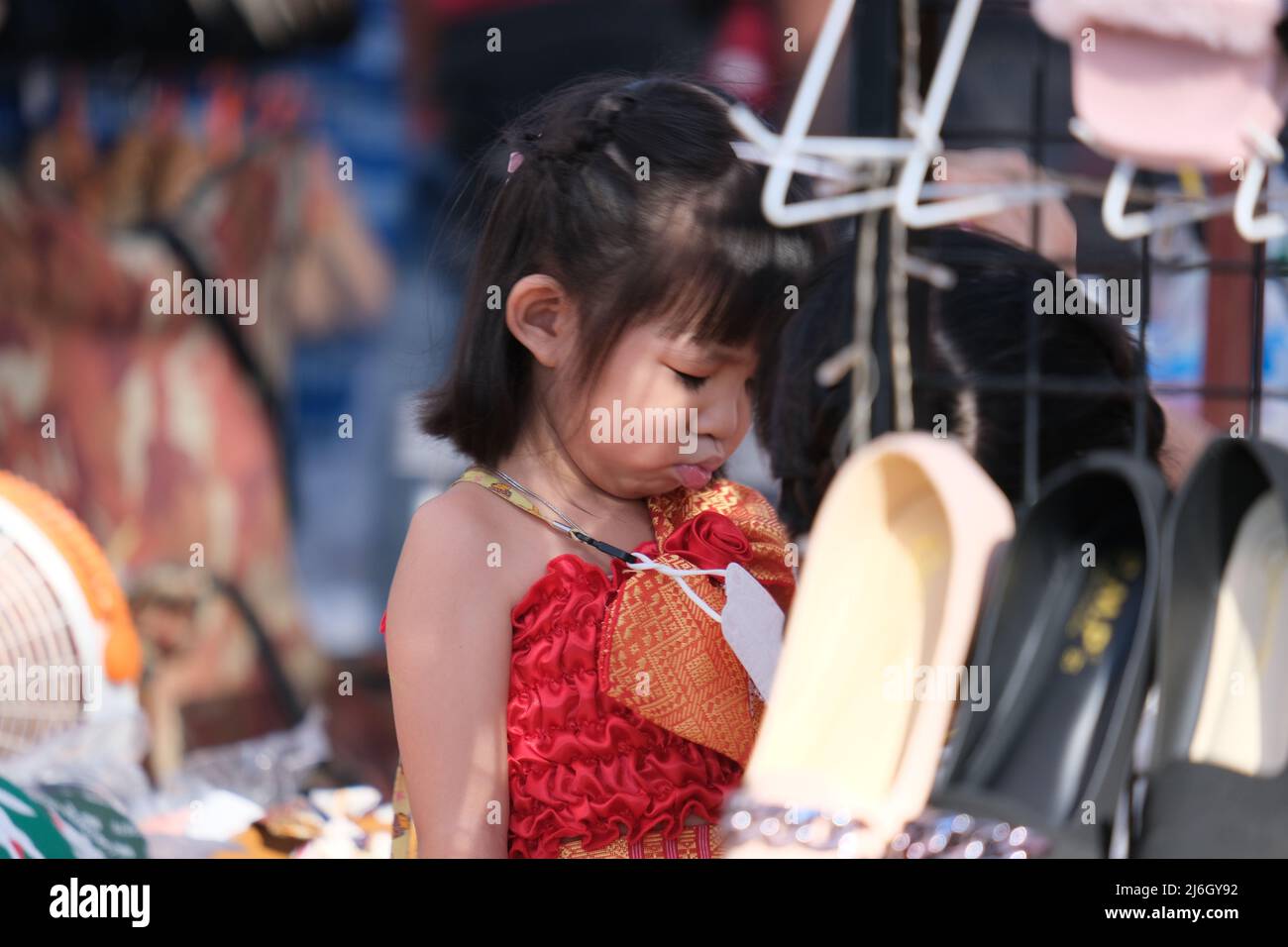 Very cute and shy Asian girl of age 6 Stock Photo