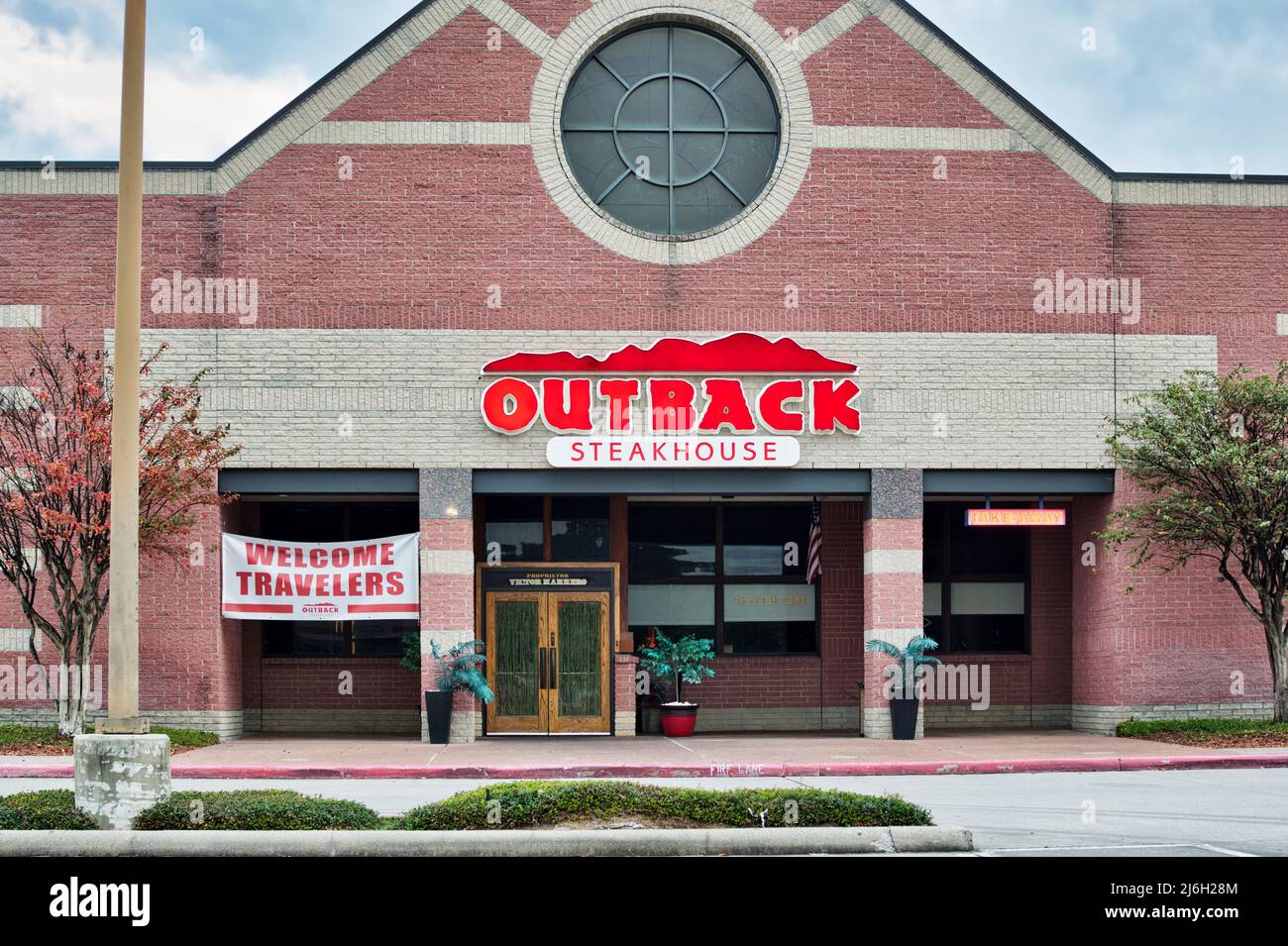 Houston, Texas USA 12-03-2021: Outback Steakhouse storefront and front entrance in Houston TX. Australian themed American restaurant founded in 1988. Stock Photo