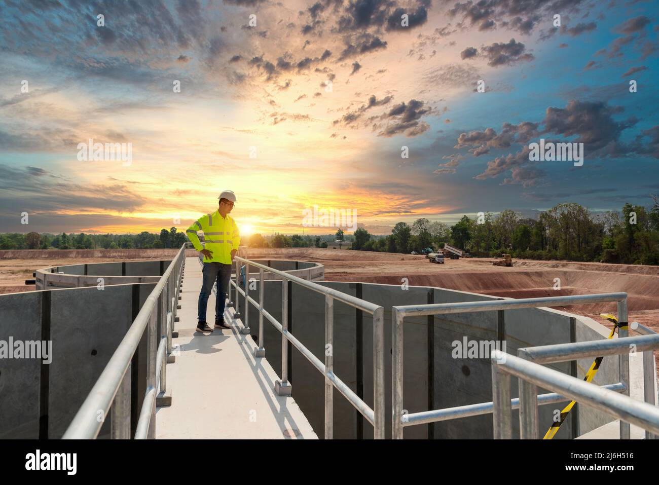 Civil Engineer inspects the construction of a large sewage-water treatment pipe unfinished Stock Photo