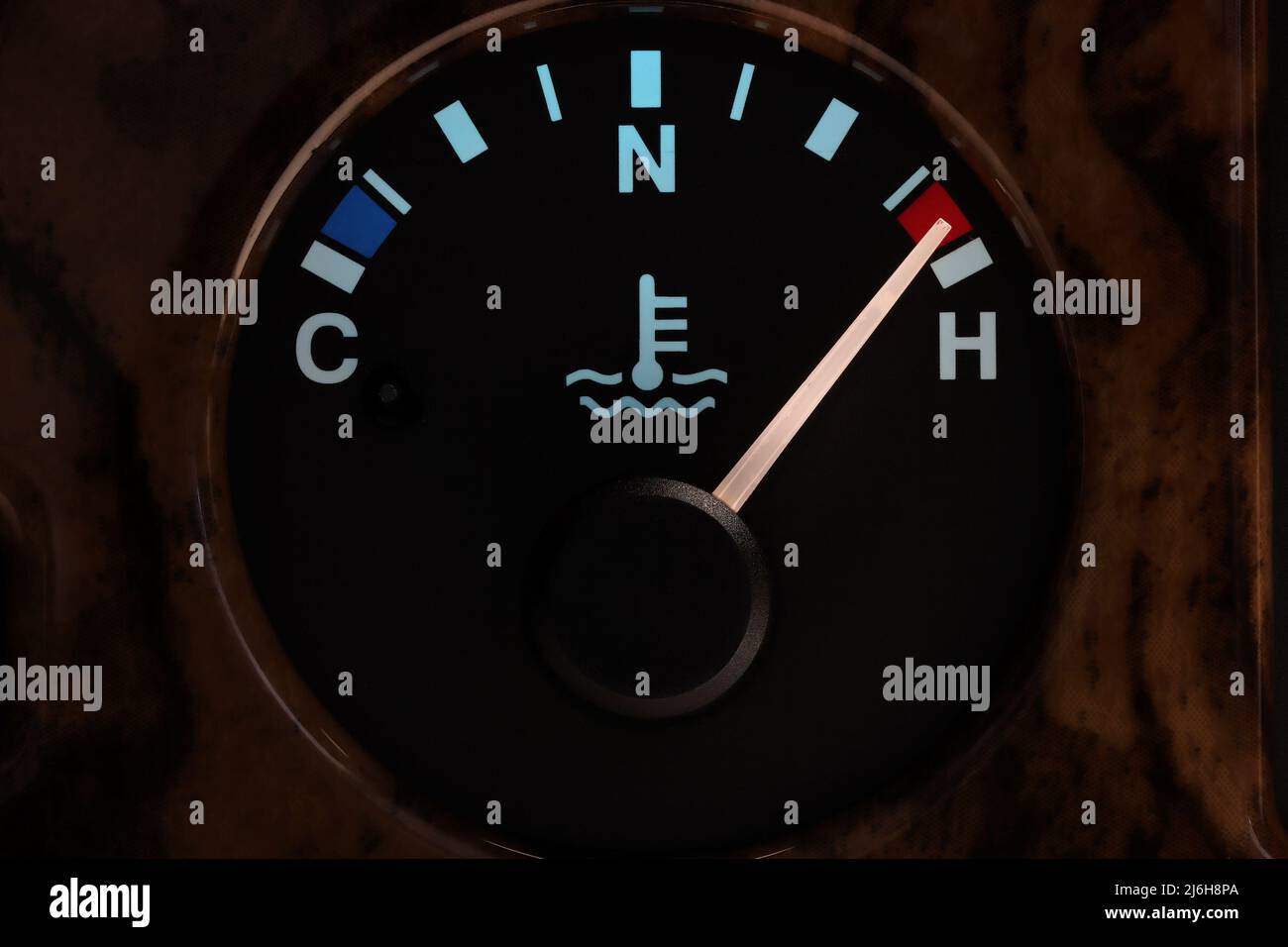 temperature gauge in car dashboard in illuminated night mode hot