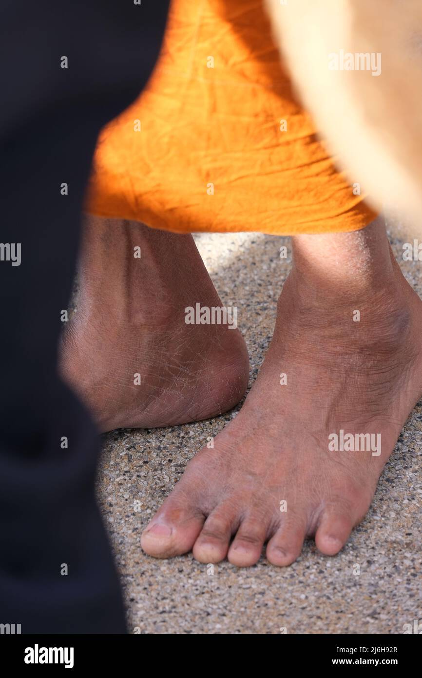 A bare foot of a Buddhist monk Stock Photo