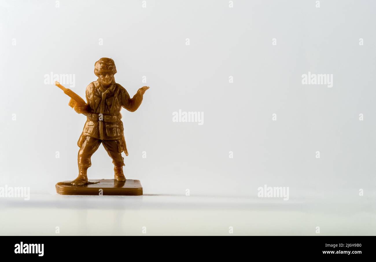 Childs Plastic toy soldier platoon leader in brown on a pedestal Stock Photo