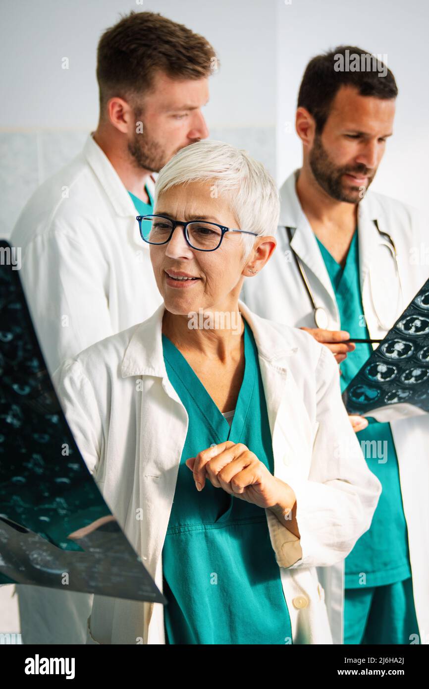 Group of doctors checking xrays in a hospital Stock Photo Alamy