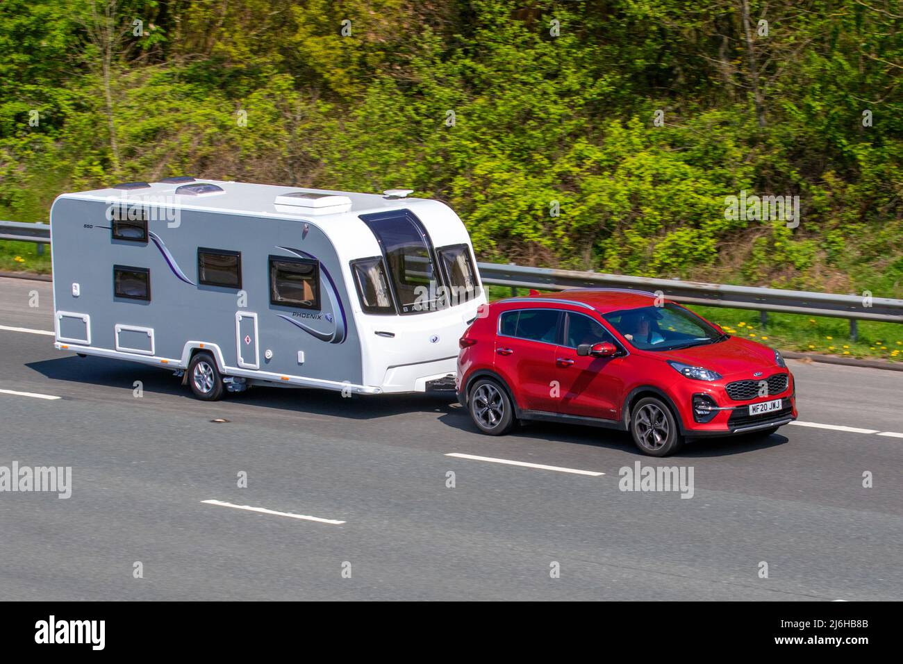 2020 red Kia Sportage 1591cc towing Bailey Phoenix 650 caravan five berth, lightweight family