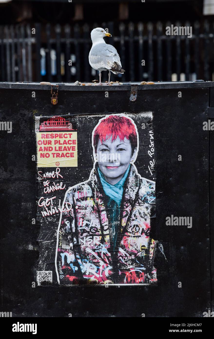 Brighton UK 2nd May 2022 - A poster with Green MP Caroline Lucas asking visitors not to leave litter behind along Brighton Beach and seafront on a dull cloudy May Bank Holiday morning  : Credit Simon Dack / Alamy Live News Stock Photo