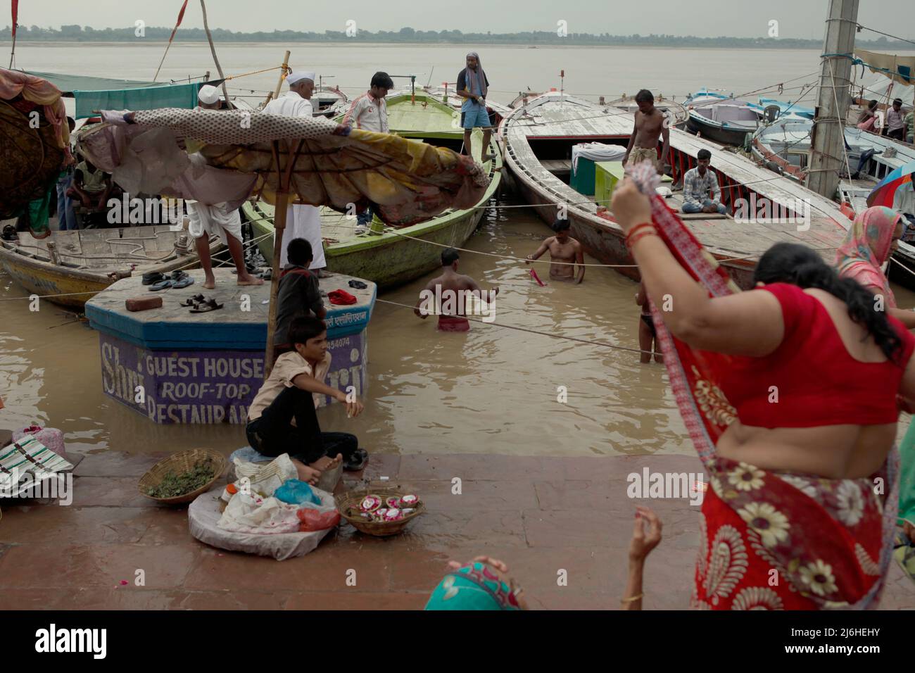 Pilgrims bathing on Dasaswamedh Ghat during Ganges floods in Varanasi ...