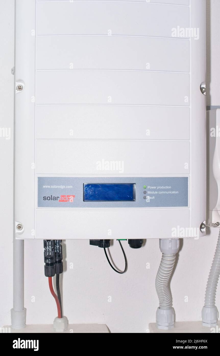 Solaredge photovoltaic power inverter on a wall - clean energy concept Stock Photo