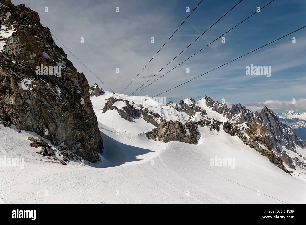The suspended support pillar of the Vallée Blanche cable car, anchored between the rocks of the Large and the Small Flambeau. Stock Photo