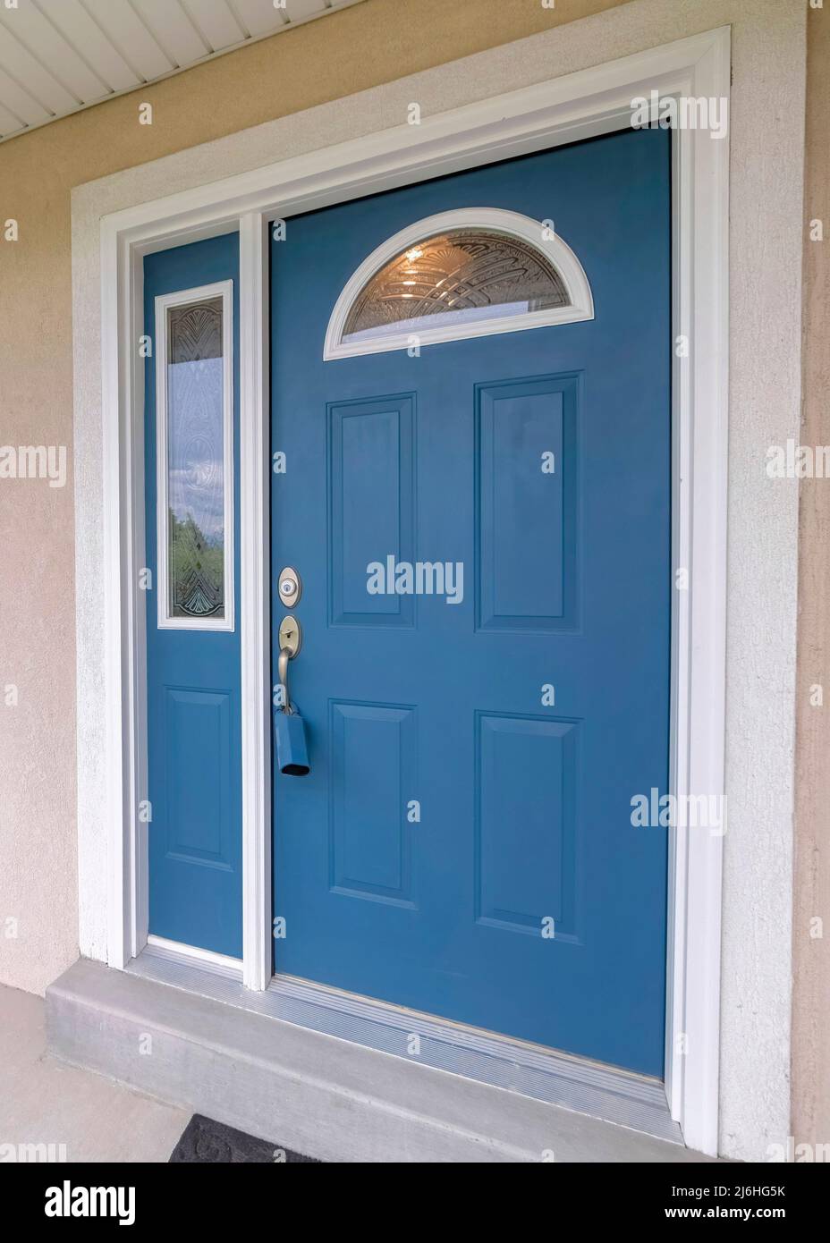 Vertical Blue front door with lockbox, arched glass panes and ...