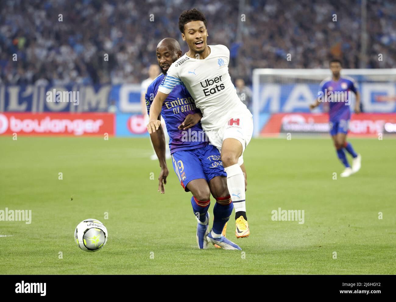 Boubacar Kamara of Marseille, Moussa Dembele of Lyon (left) during the French championship Ligue 1 football match between Olympique de Marseille (OM) and Olympique Lyonnais (OL, Lyon) on May 1, 2022 at Stade Velodrome in Marseille, France - Photo: Jean Catuffe/DPPI/LiveMedia Stock Photo