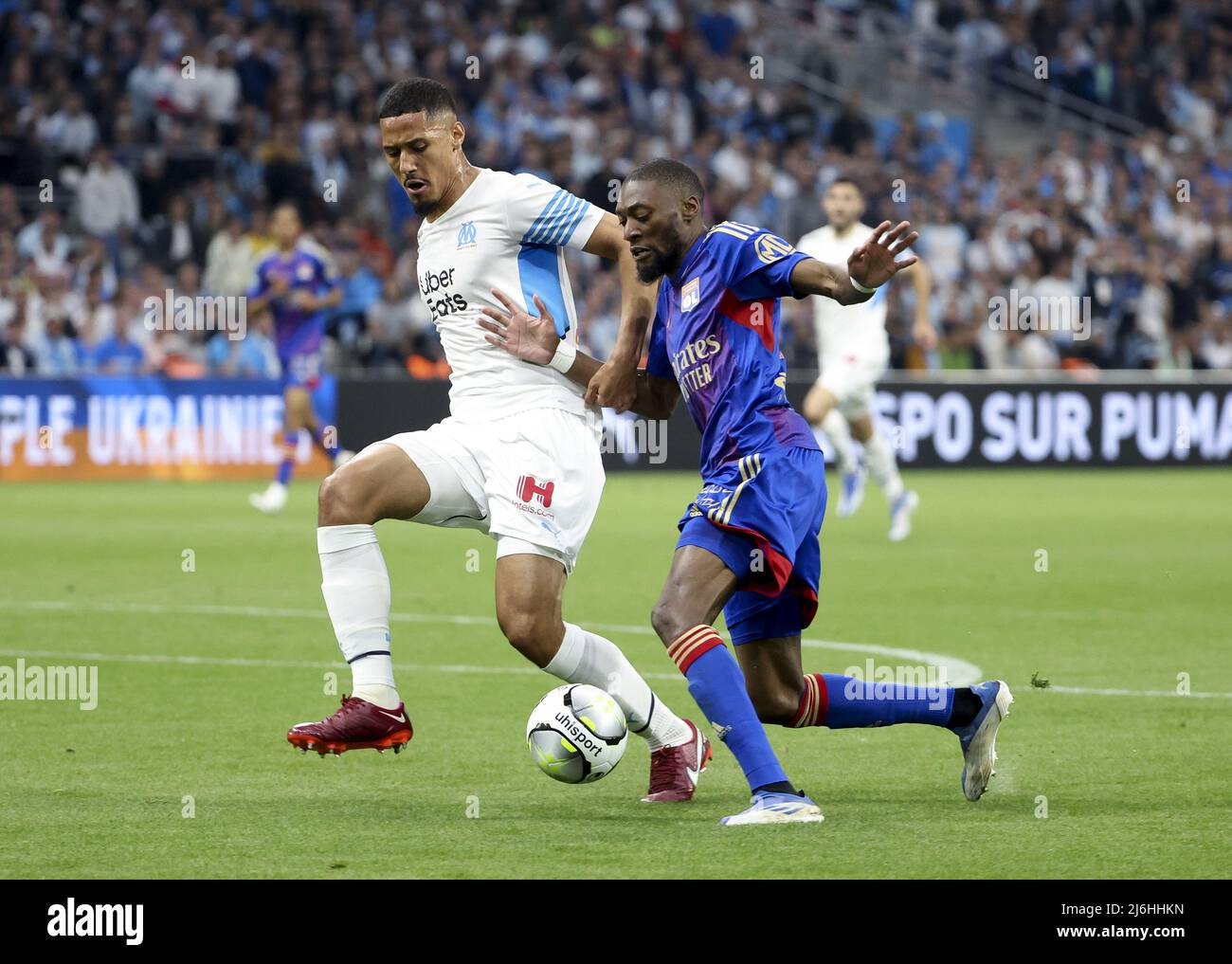Karl Toko Ekambi of Lyon, William Saliba of Marseille (left) during the  French championship Ligue 1 football match between Olympique de Marseille  (OM) and Olympique Lyonnais (OL, Lyon) on May 1, 2022