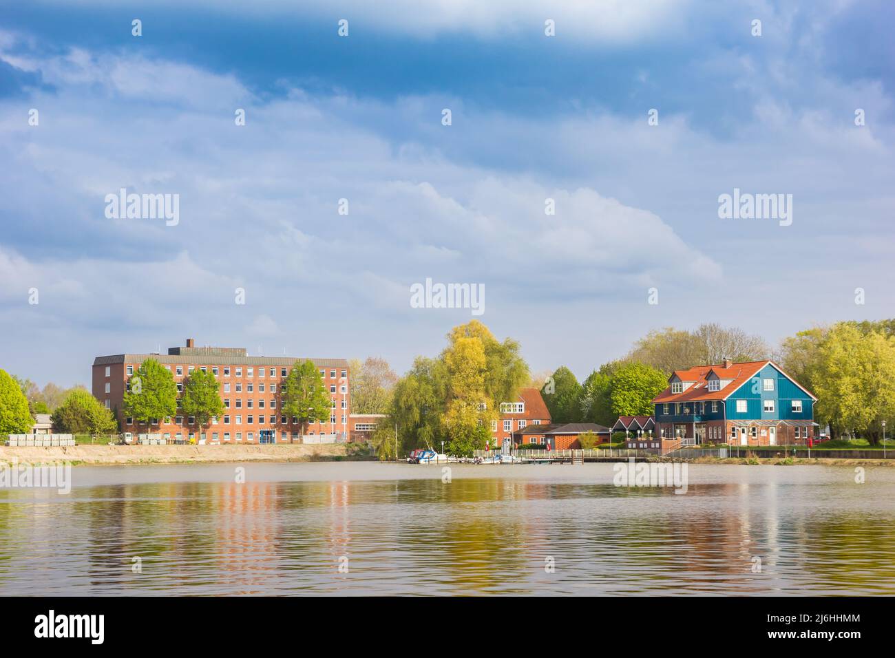 Colorful house and apartment building at the Leda river in Leer, Germany Stock Photo