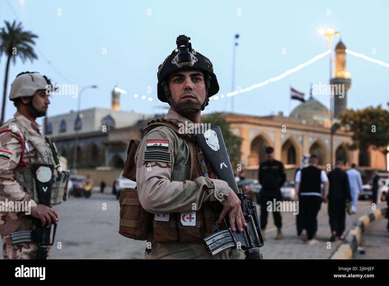 02 May 2022, Iraq, Baghdad: Iraqi security forces stand guard during Eid al-Fitr prayer, which marks the end of the Muslim holy month of Ramadan, at Abu Hanifah an-Nu'man Mosque in the al-Adhamiyah district of northern Baghdad. Photo: Ameer Al-Mohammedawi/dpa Stock Photo