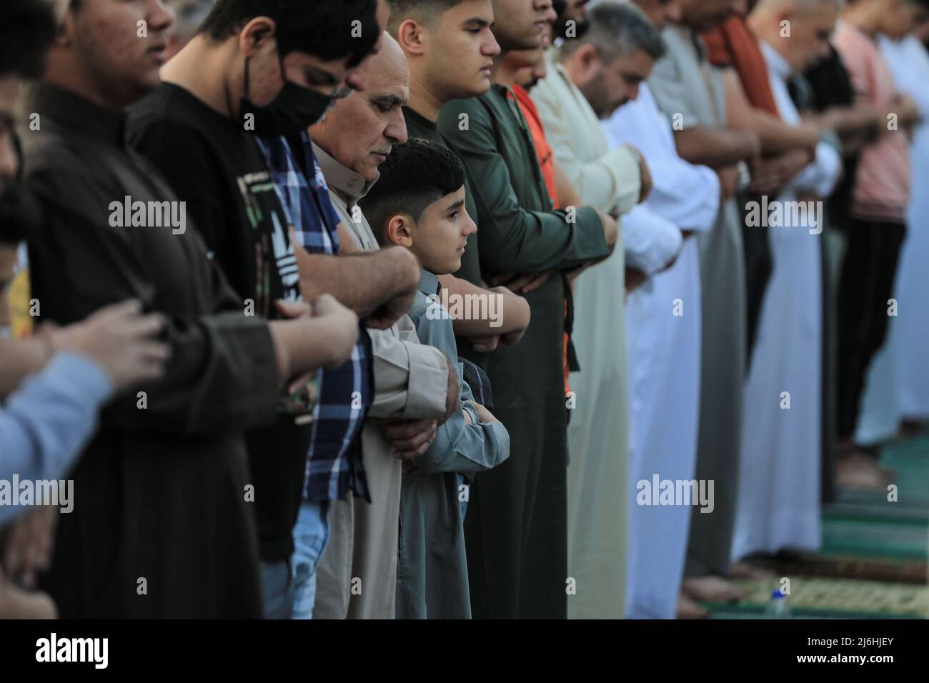 02 May 2022, Iraq, Baghdad: Iraqi worshippers perform Eid al-Fitr prayer, which marks the end of the Muslim holy month of Ramadan, at Abu Hanifah an-Nu'man Mosque in the al-Adhamiyah district of northern Baghdad. Photo: Ameer Al-Mohammedawi/dpa Stock Photo