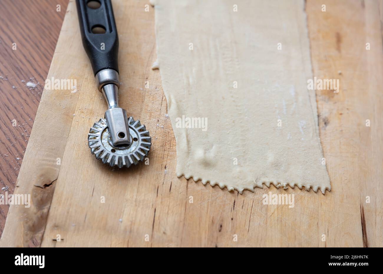 Cutter Wheel On A Puff Pastry Layer Stock Photo - Download Image