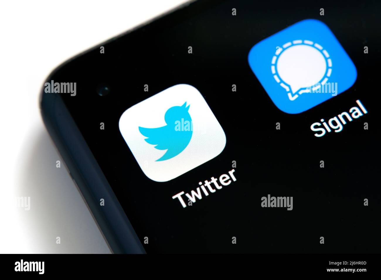 The smartphone corner with Twitter and Signal apps macro photo. Twitter plan to use the encryption as in messaging Signal app. Stafford, United Kingdo Stock Photo