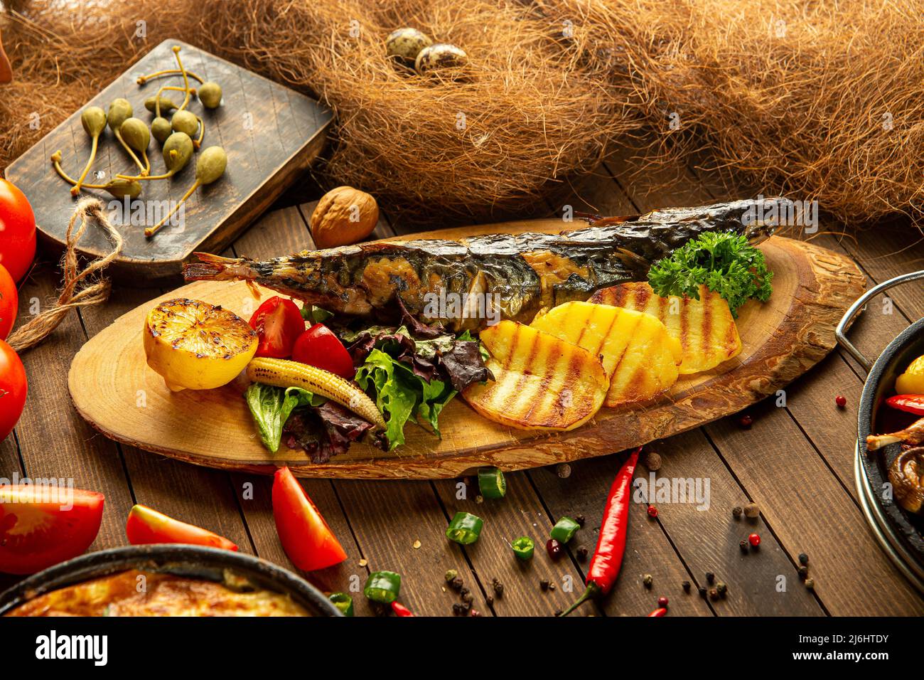 Grilled mackerel fish with potatoes Stock Photo Alamy