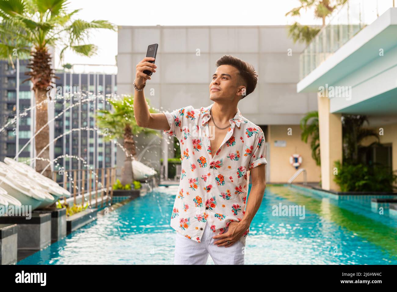 Portrait of handsome young cool stylish man during summer Stock Photo