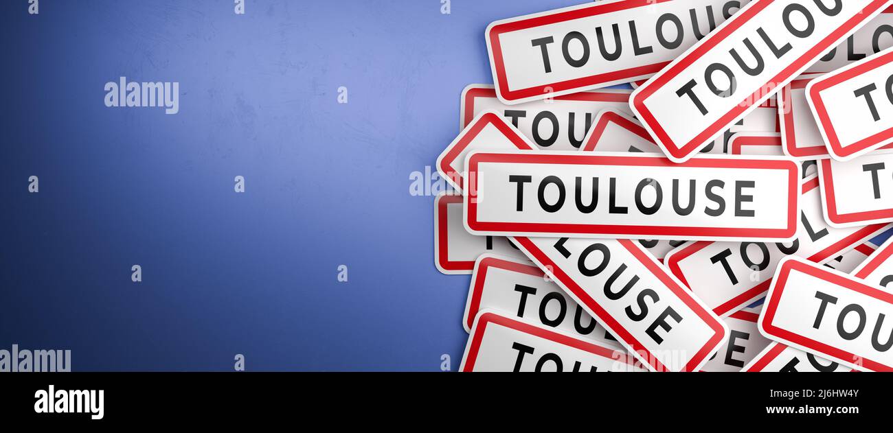 Multiple Toulouse city-limit signs on a heap. Toulouse is located in the Haute-Garonne department, France. The typical white city limit sign with a re Stock Photo