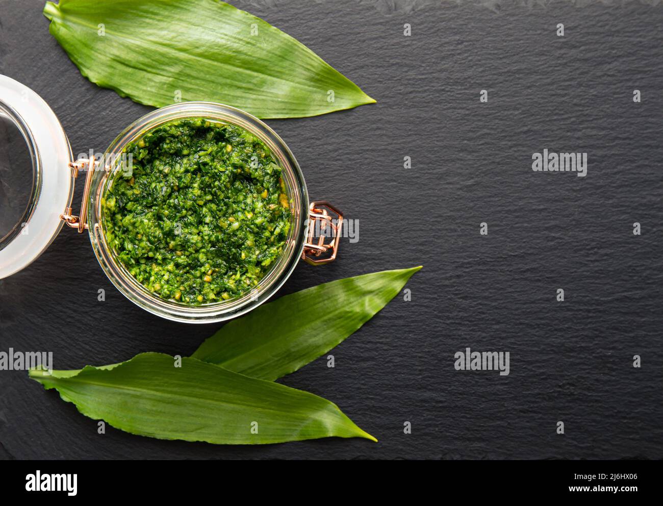Homemade pesto sauce made with Allium ursinum leaves, known as wild garlic, ramsons, buckrams