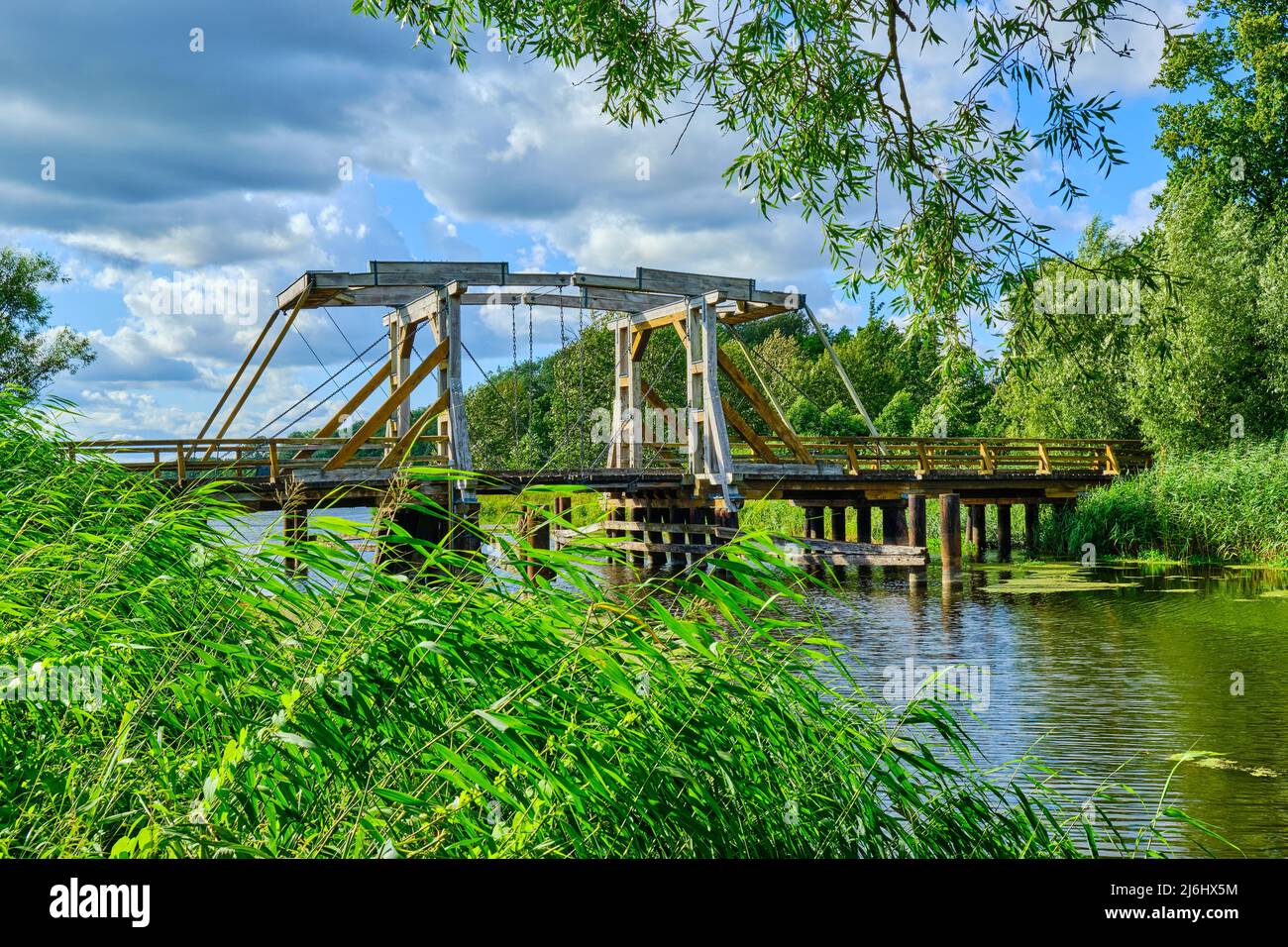 Listed wooden bascule bridge spanning the Trebel near Nehringen, Mecklenburg-Western Pomerania, Germany. Stock Photo