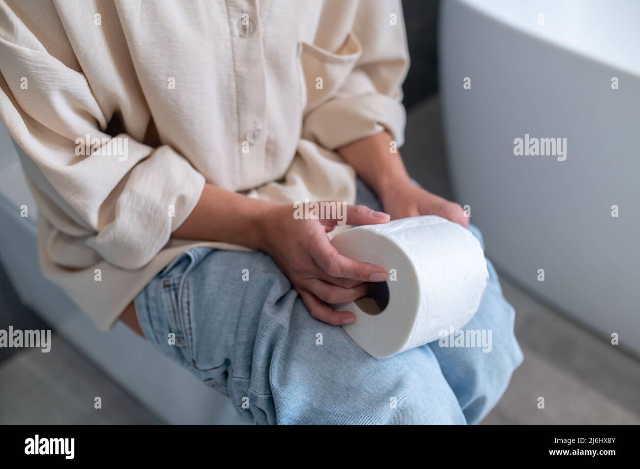 Close up picture of a woman in the water closet Stock Photo