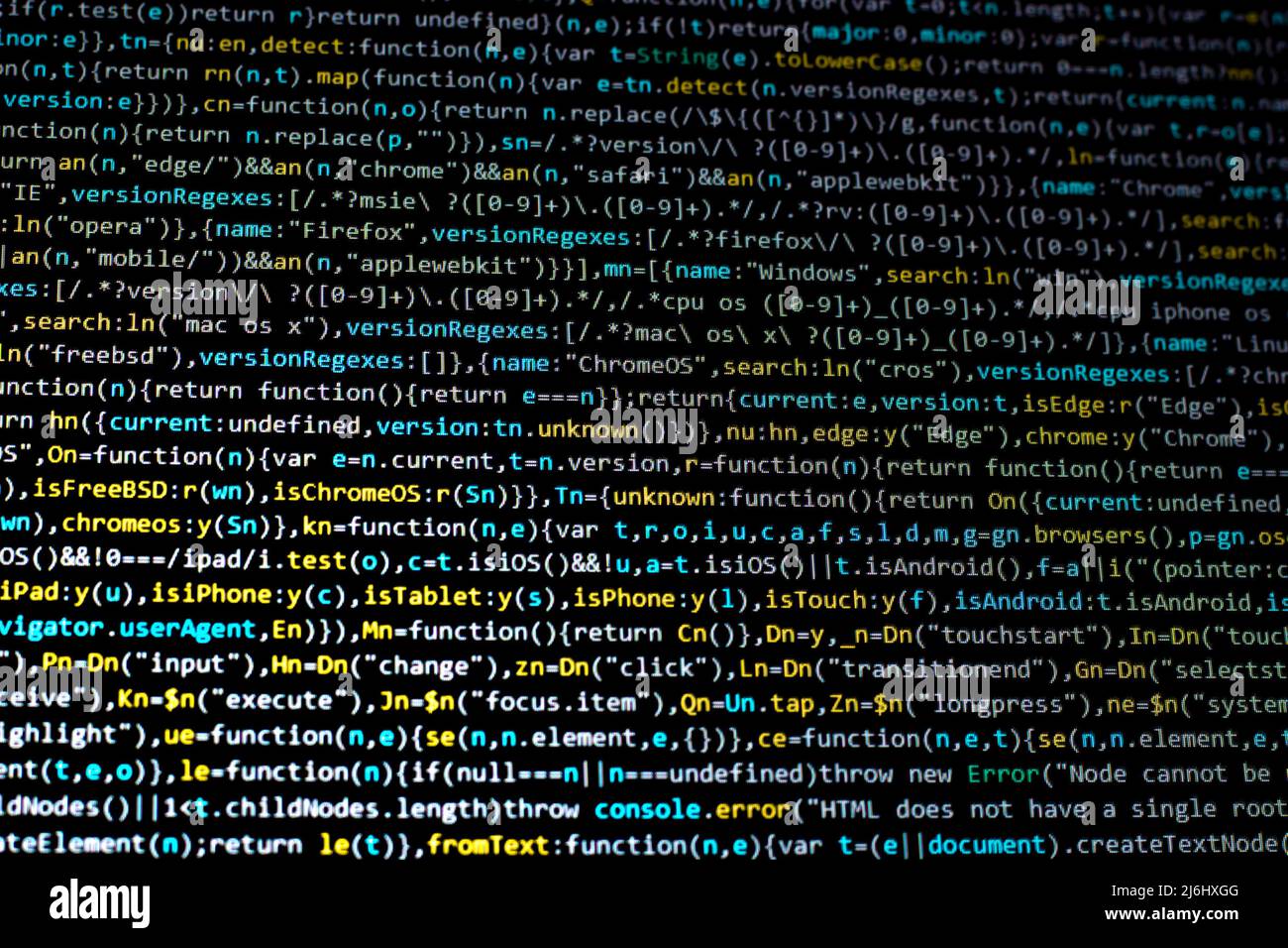 blue yellow code lines on black computer screen right across view. colorful coding cyber space creative concept back ground idea. Stock Photo