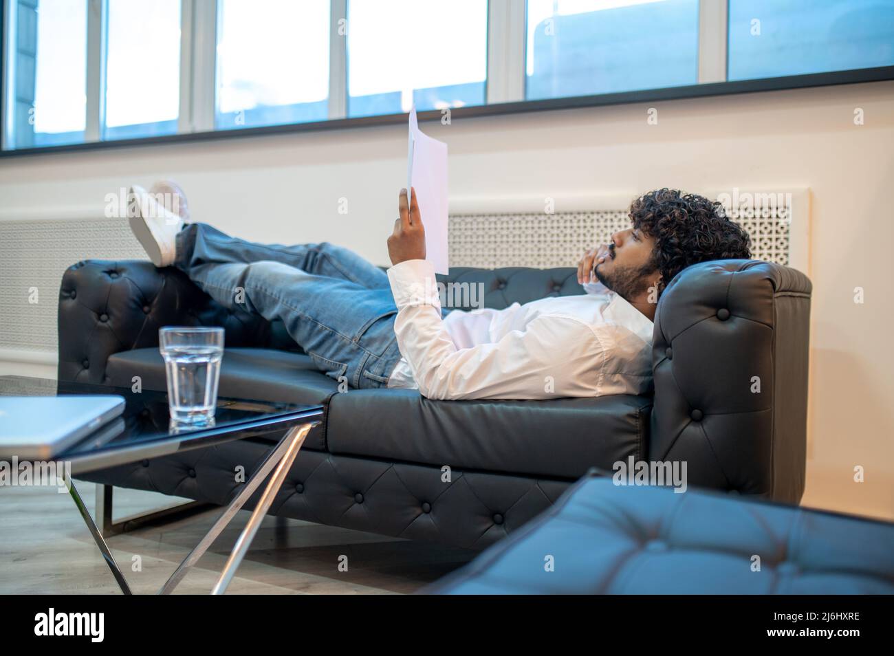 Focused businessman reading documents in his office Stock Photo