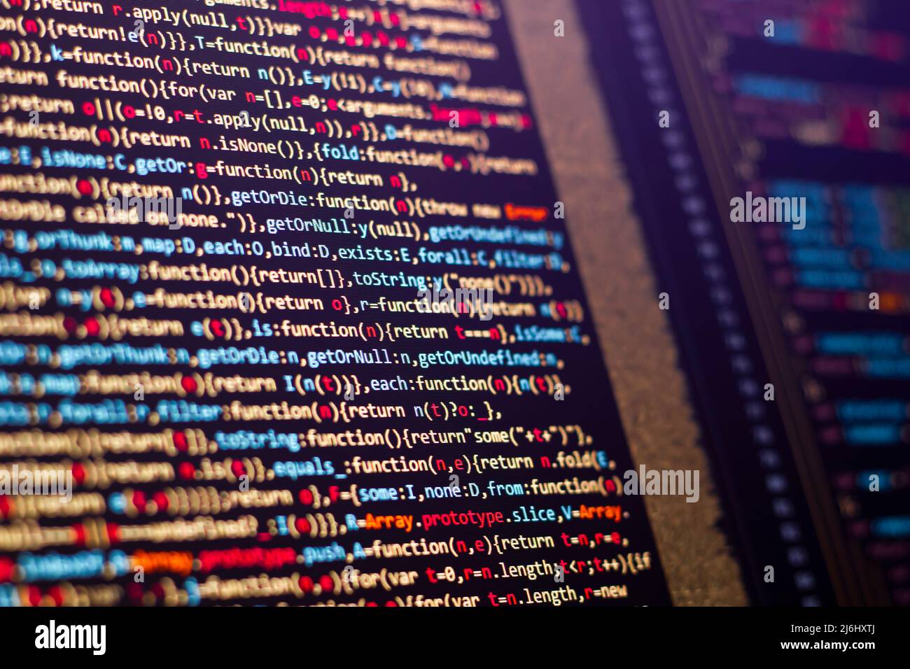 coding lines on the laptop screen. selective focus with some part blurred various colors. Stock Photo