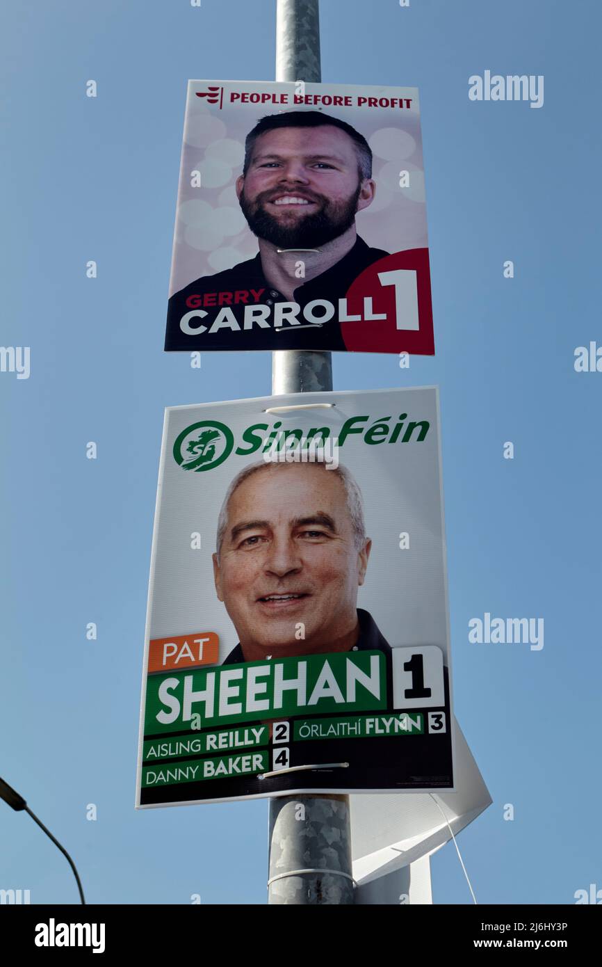 People before Profit and Sinn Fein election posters on the Falls Road, West Belfast, Northern Ireland, 20th April 2022. Stock Photo